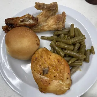 Fried chicken wing, teriyaki chicken wing, green beans, baked chicken breast! My first plate!