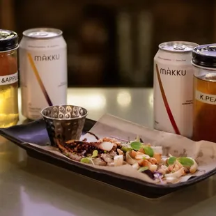 Dried calamari and peanuts pairs well with Makku Beer, or  our house infuse soju!