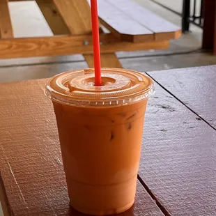 a plastic cup of iced coffee