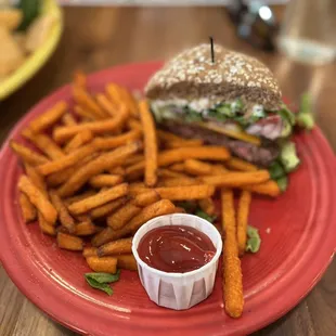 Bacon Cheeseburger with sweet potato fries. Medium rare