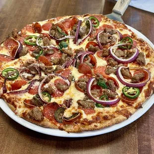 BYO-Pizza: Italian sausage, fresh jalapeño, red onion and those Pepperoni cups (you know, if you know)