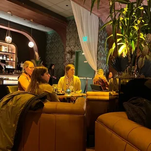 a group of people sitting at a bar
