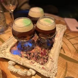 three glasses of beer on a table