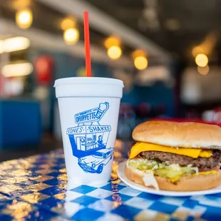 a cheeseburger and a drink