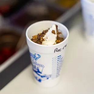 a cup of ice cream and a cup of granola