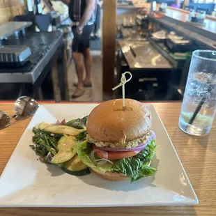 Crab cake sandwich and seasonal vegetables.