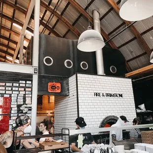 people working in the kitchen of a restaurant
