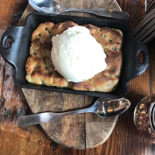 Chocolate chip skillet cookie with vanilla ice cream on top!