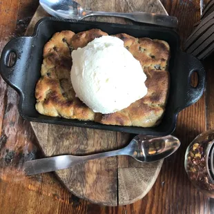 Chocolate chip skillet cookie with vanilla ice cream on top!