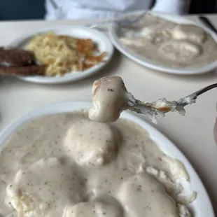a plate of mashed potatoes and gravy
