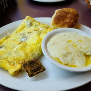 Meat lovers omelet, grits and biscuit