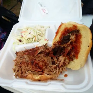 The pulled pork sandwich with BBQ sauce.