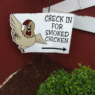 a sign with a chicken on it