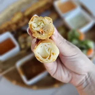 Three types of egg rolls in the smaller. Cream cheese, pork and beef.