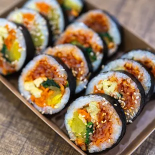 a plate of sushi rolls