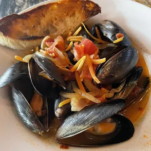 a plate of musselling and bread