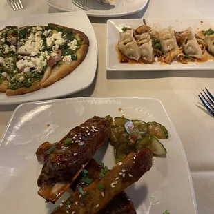 All four items mentioned.  Ahi Tuna Street Tacos Plate Korean Sticky Ribs Plate Potstickers Plate, and flat bread.