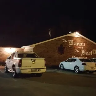 cars parked in front of a restaurant