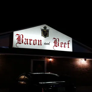 a car parked in front of a restaurant