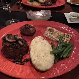 Filet, grilled duck breast, Alaakan halibut, green beans, twice baked potatoe.