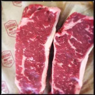 Awesome 1.75in thick NY Strip steaks from #baronsqualitymeats on Church here in SF. #steak #nystrip #charcoal