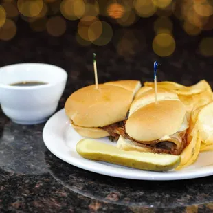a plate of sandwiches and chips
