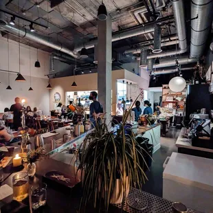 people sitting at tables in a restaurant