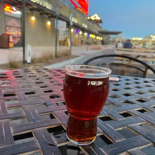 a glass of beer on a table
