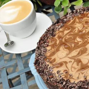 a chocolate cake and a cup of coffee