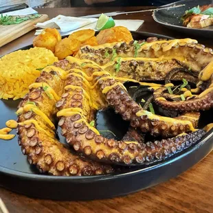 Grilled octopus with rice &amp; papas endiabladas.