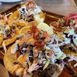 A variety of tacos (Fried Fish Taco, Fried Shrimp Taco, Surf &amp; Turf Taco, and Carne Asada Taco)
