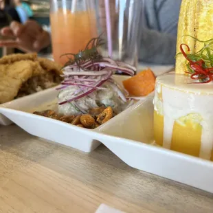 Trio: La Ronda Brava (Ceviche, Causa, Jalea Mixta). Deep fried seafood, fish ceviche and causa- spicy layers of potatoes w/chicken salad.