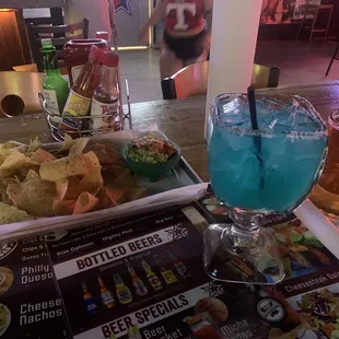 Blue margarita and chips, guac