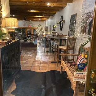 a living room with a cow hide rug