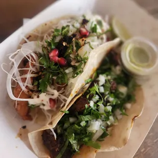 Crispy fish and pork tacos