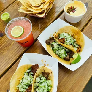 Bottom left to right: pork taco, beef taco Top left to right: beef taco, chicken taco