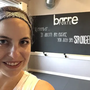 With sign in the studio back wall.