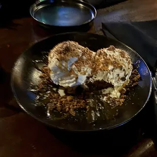 Brownie and ice cream with butterfinger topping.