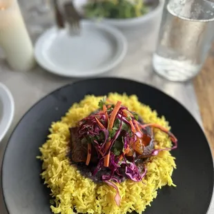 Salmon with refried beans, saffron rice and mango chutney