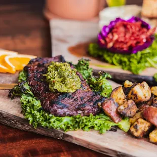 Sharable gourmet boards for date nights, group gatherings, girls nights. Photo: Achiote Marinated Steak- Rosemary lemon confit potato