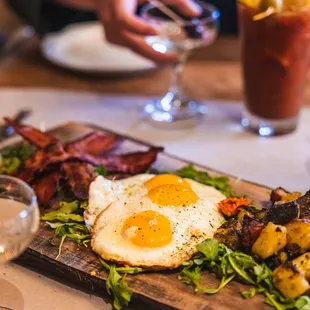Sunday Brunch featuring sharable boards, &amp; $3 Mimosas. Photo: Plain Jane-
Eggs, Charred Breakfast Potatoes, Applewood Smoked Bacon, arugula