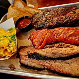 a platter of meat and sides