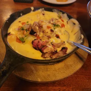 Smoked brisket queso served lukewarm.