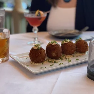 Gouda short rib arancini. I Put a Spell on You. House Smoked Old Fashion.