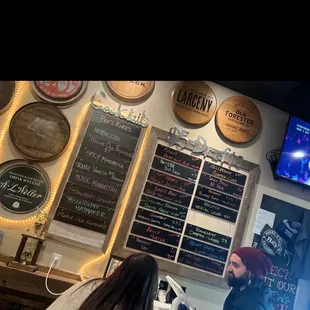 a man and a woman at a bar