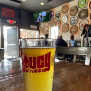 a pint of beer on a table