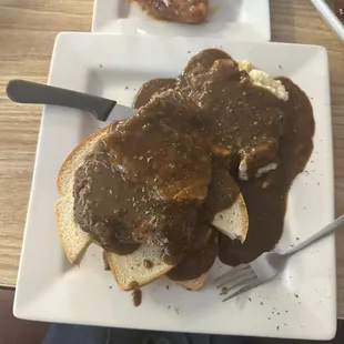 Open faced roast beef sandwich with potatoes and gravy. Potatoes are powdered. Gravy was also a little too salty.