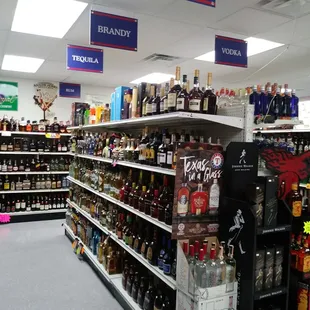 a liquor aisle in a grocery store
