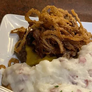 Pulled pork and cheese over a burger all over mash potatoes. Gotta give it a try