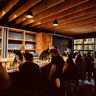 a group of people sitting at a bar